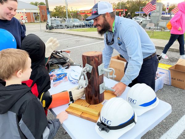 Decatur lineman Travis Kowanetz demonstrates the everyday challenges linemen face.