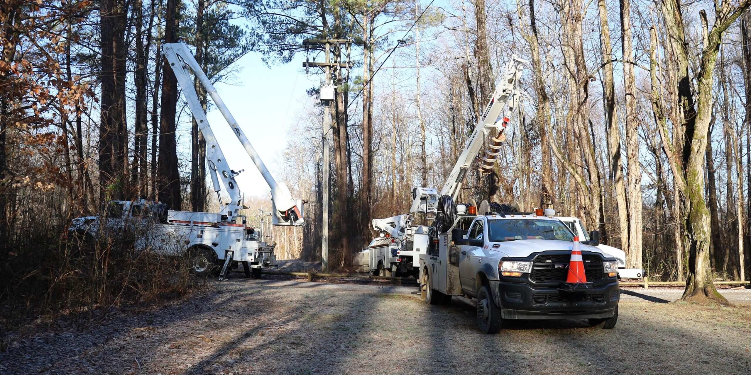 Linemen prepare the job site for the morning’s project.